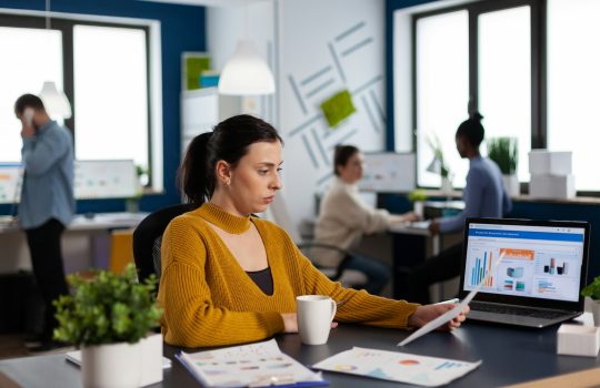 Multiethnic people of start up company analasing financial charts